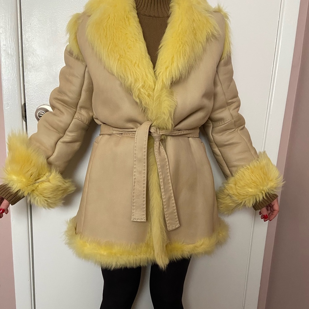 Tan leather coat with yellow fur lining